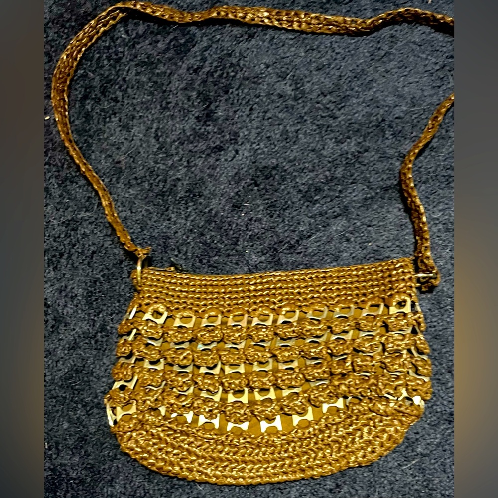 Brown Purse made out of plastic bags and can tabs